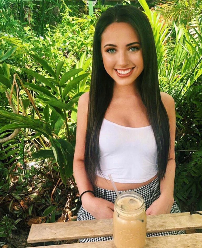 hair extensions girl sitting with drink