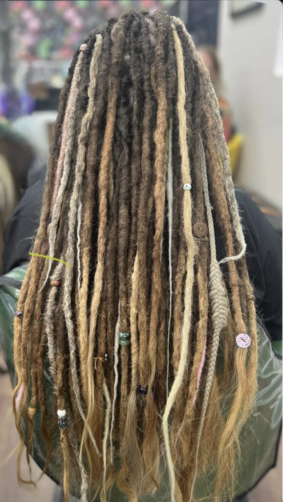 dreadlock extensions in blonde and browns