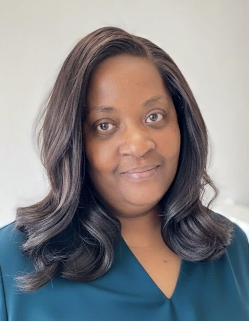 lace closure sew on middle age black woman wearing teal shirt