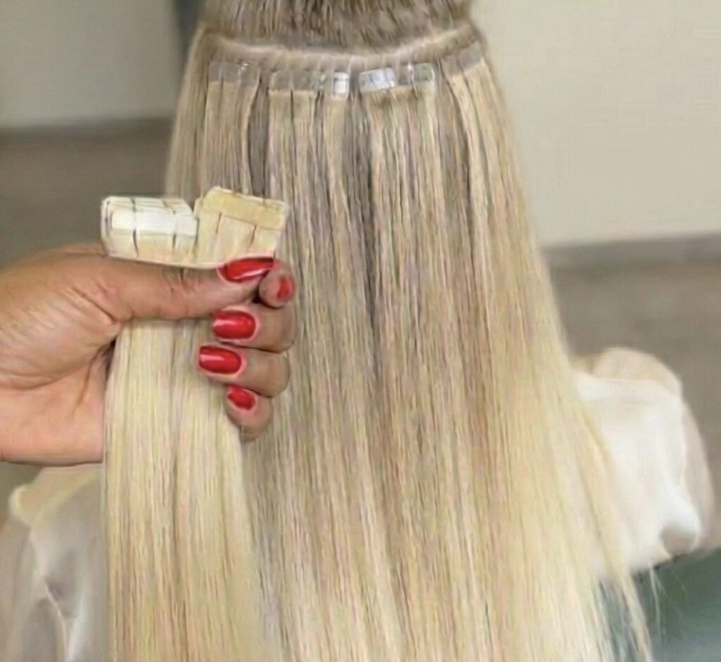 tape in hair extensions on blonde hair a tampa salon